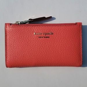 Kate Spade Leather Roulette Small Slim Bifold Wallet. Color: Peachmelba.